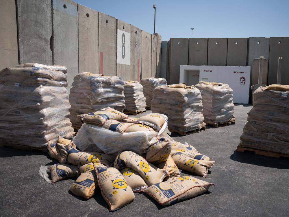 Food is stacked on pallets on the Israeli side of the border crossing with Gaza, which is enduring a humanitarian crisis. Israel says the bottleneck is on the Gaza side.