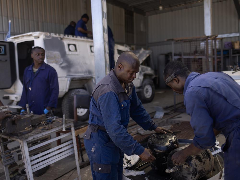A Ghanaian battalion repairs UNIFIL vehicles inside the base.