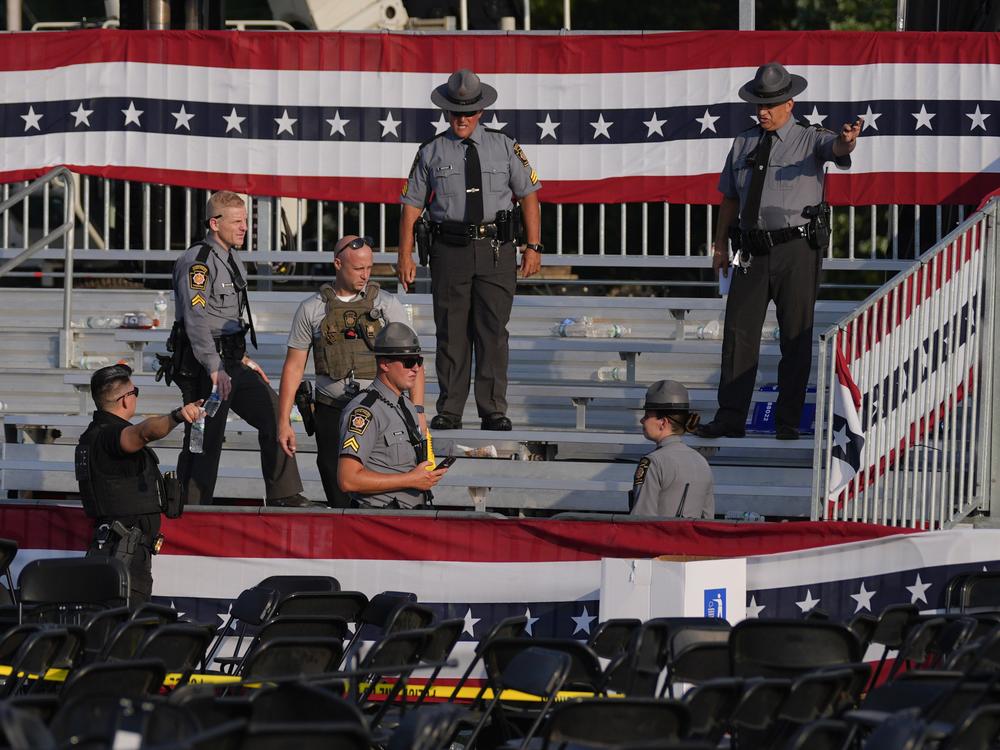 Law enforcement officers gather at the campaign rally site for Republican presidential candidate former President Donald Trump  on Saturday, July 13, 2024, in Butler, Pa. Trump's campaign said in a statement that the former president was 