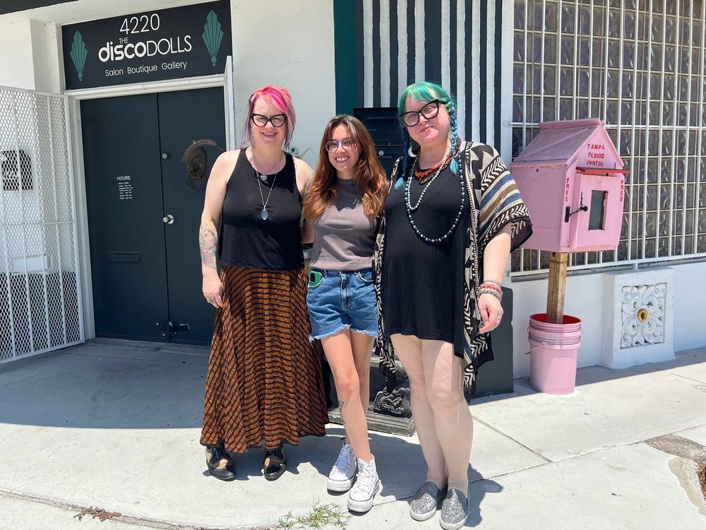 Tampa Period Pantry founder Bree Wallace (center) worked with co-owners of the Disco Dolls Studio in Tampa, Leigh Anne Balzekas (right) and Kristine Ownley (left) to open the first location outside the business last August. The store also has a donation box inside where customers can drop off products.<br>