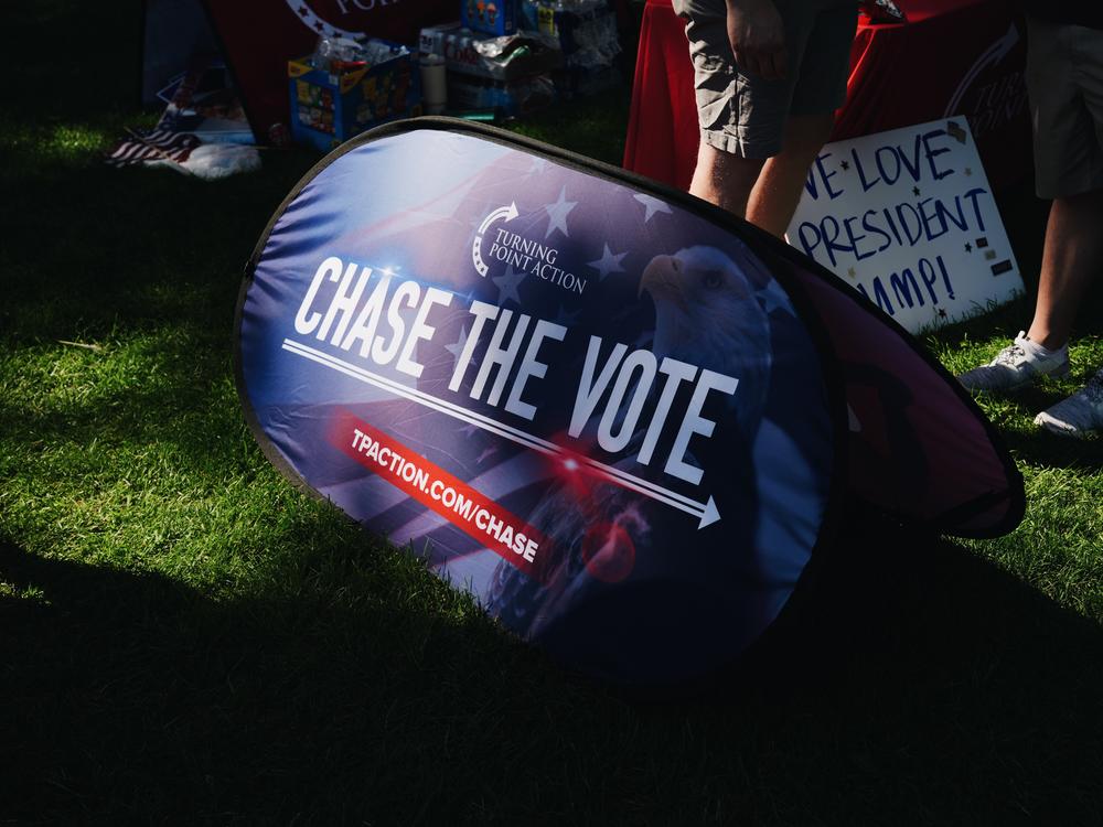 Chase the Vote signs all around the prayer vigil and voter registration event is held for former president Donald Trump in the downtown area before the start of the Republican National Convention (RNC) on July 14, 2024 in Milwaukee, Wisconsin.