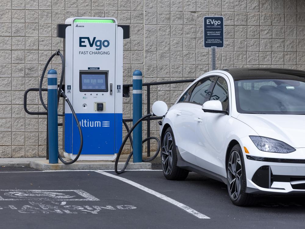 An electric vehicle is seen charging in New Jersey on June 11, 2024. 