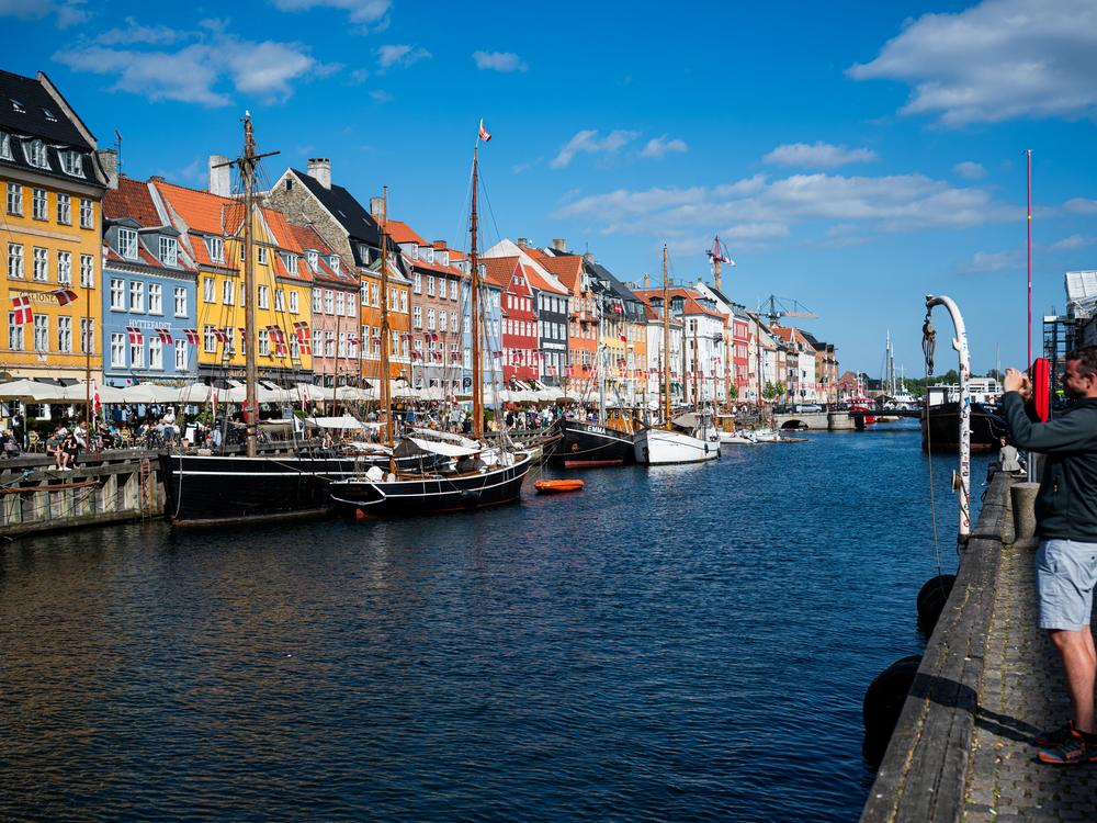 Tourists visit Nyhavn, the 17th-century waterfront, in Copenhagen, Denmark, in this 2021 file photo.