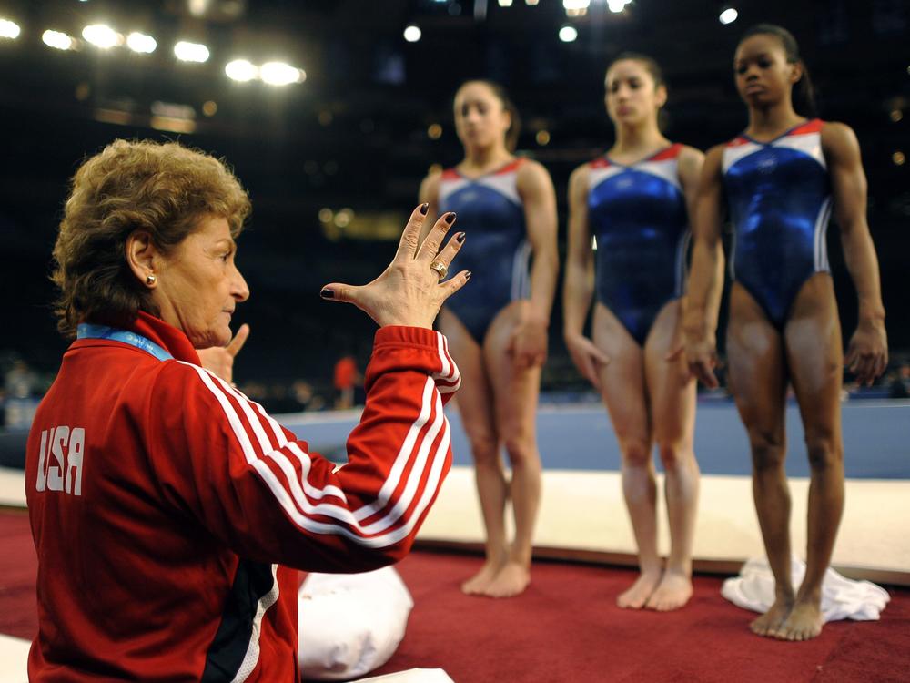 Then-U.S. national team coach Marta Karolyi talks with (from left) Jordyn Wieber, Alexnadra Raisman and Gabby Douglas during practice at the 2012 AT&T American Cup at Madison Square Garden in New York City in March  2012. 