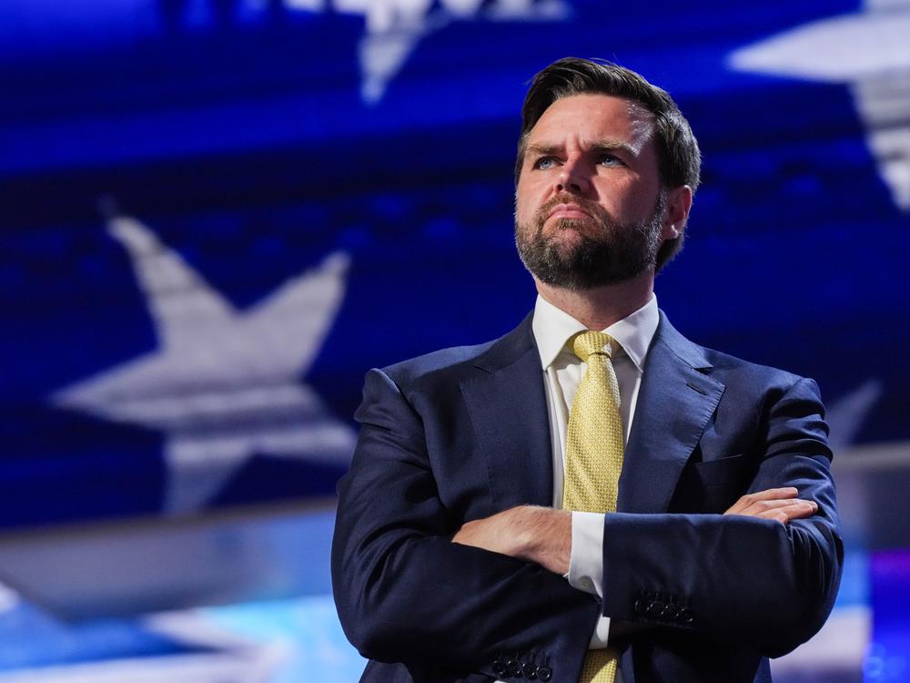 J.D. Vance, former President Donald Trump's vice presidential running mate, stands at a podium during a walkthrough for the 2024 Republican National Convention at the Fiserv Forum in Milkwaukee this week.