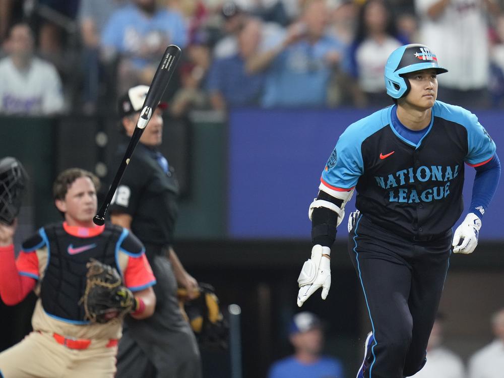 The National League's Shohei Ohtani of the Los Angeles Dodgers flips his bat as he hits a three-run home in the third inning during the MLB All-Star baseball game on Tuesday in Arlington, Texas.