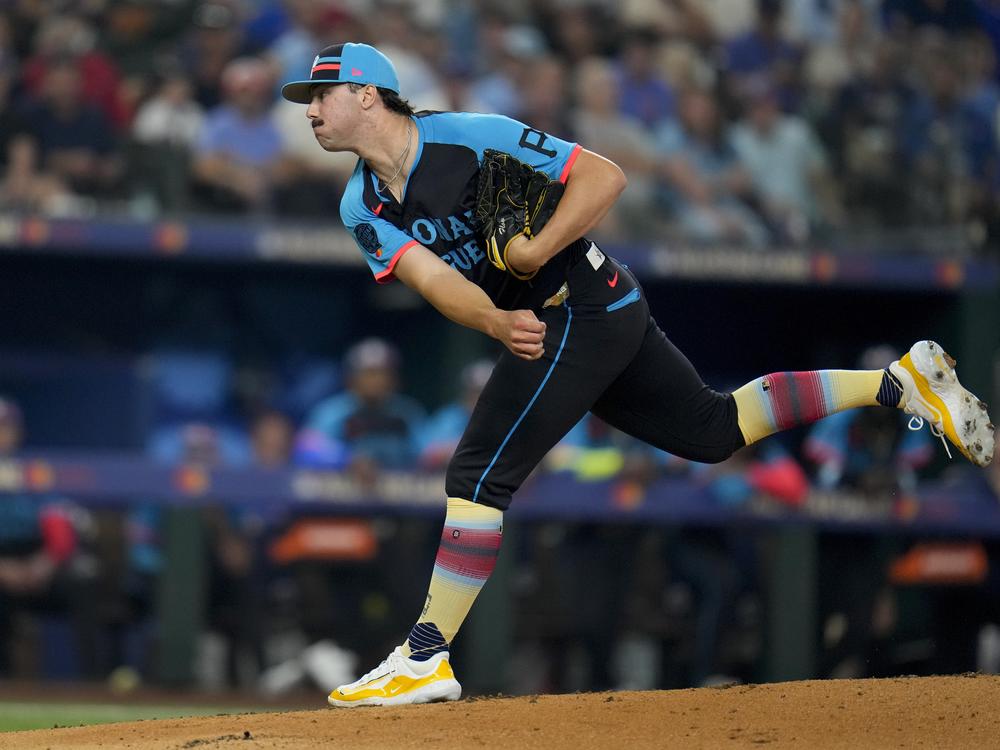 National League pitcher Paul Skenes, of the Pittsburgh Pirates, throws to an American League batter in the first inning during the MLB All-Star baseball game, Tuesday in Arlington, Texas. 