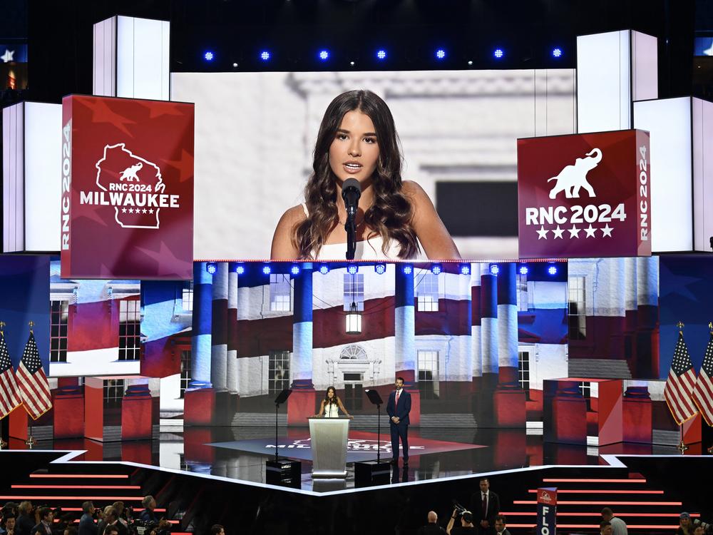 Kai Trump, 17, stands with her dad Donald Trump Jr., son of former U.S. President Donald Trump on stage on the third day of the Republican National Convention at the Fiserv Forum on July 17, 2024 in Milwaukee, Wisconsin.