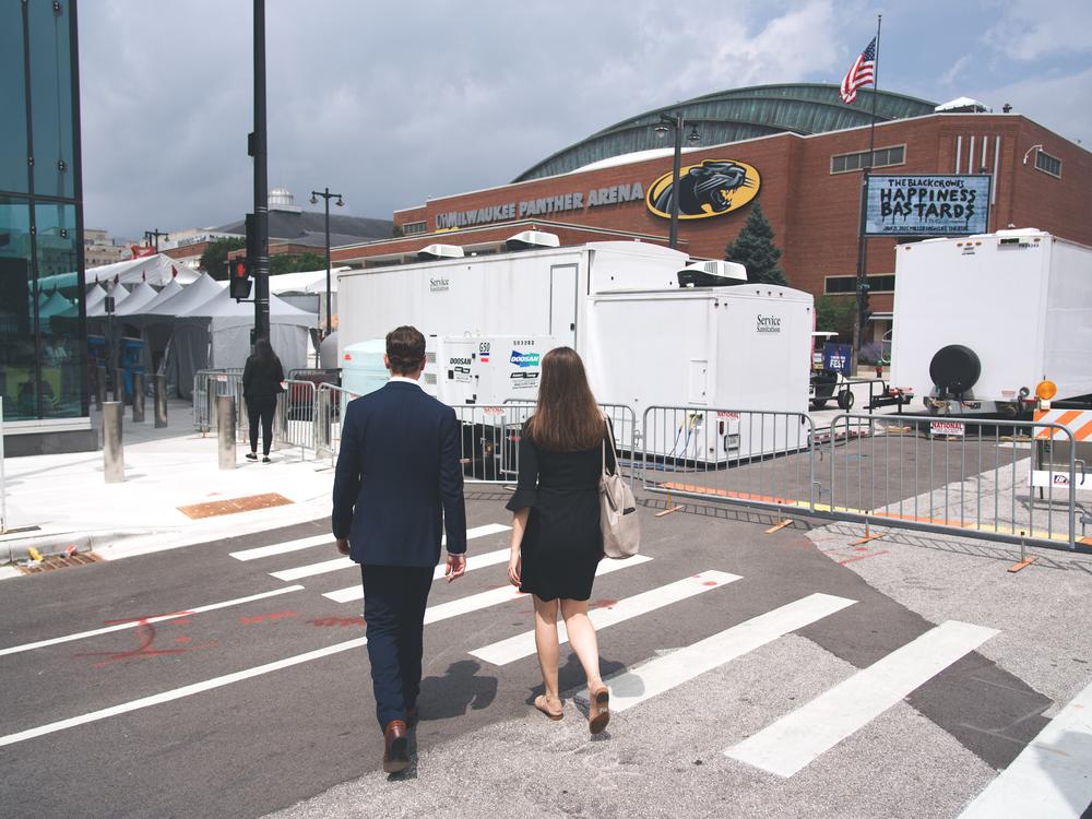 Stephen Perkins, Chief Operating Officer, and Karly Matthews, Vice President of Communication of ACC, walk towards Baird Center were American Conservation Coalition is hosting a booth at the Republican National Convention in Milwaukee, Wisconsin. 
