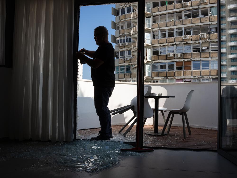 Israeli police investigate the scene of a drone attack in Tel Aviv, Israel on Friday. Yemen's Houthi militia claimed responsibility for the blast that left one dead and several injured.  