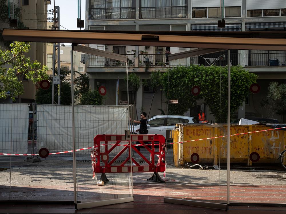Israeli policemen search the scene of an explosion on July 19.