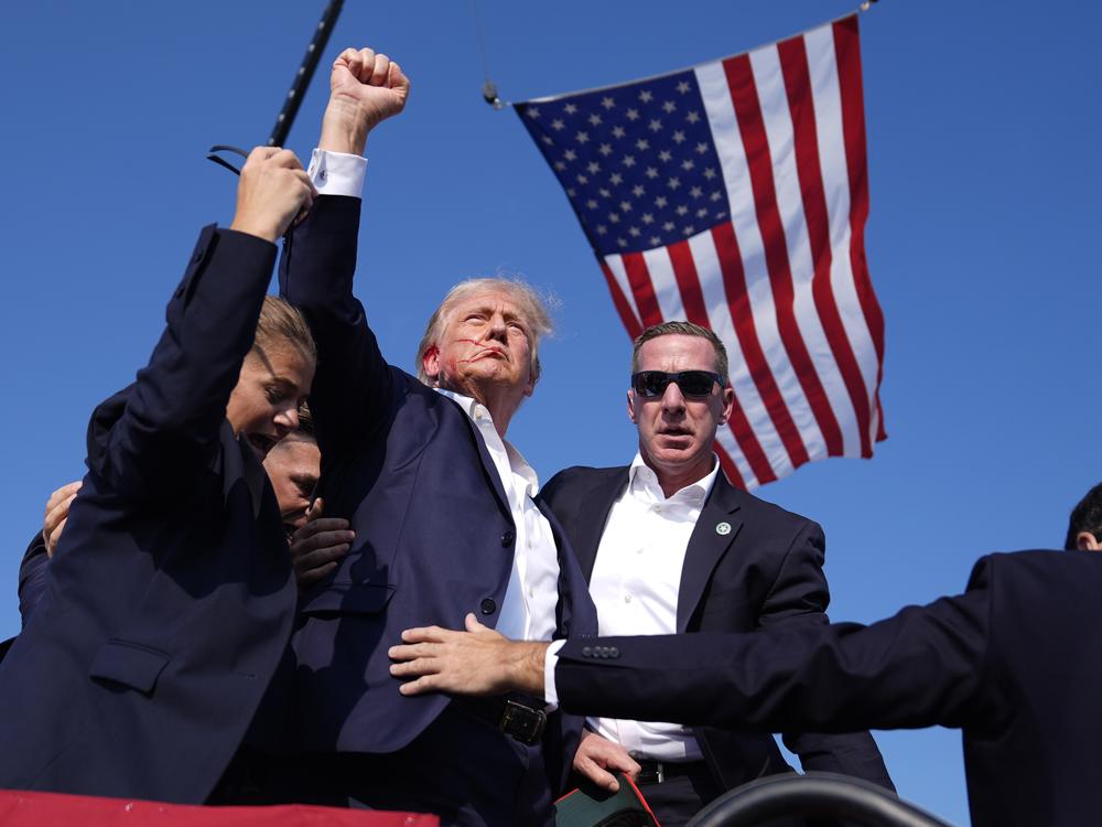 Former President Donald Trump is rushed offstage during a rally in Butler, Pa., after an assassination attempt on his life.