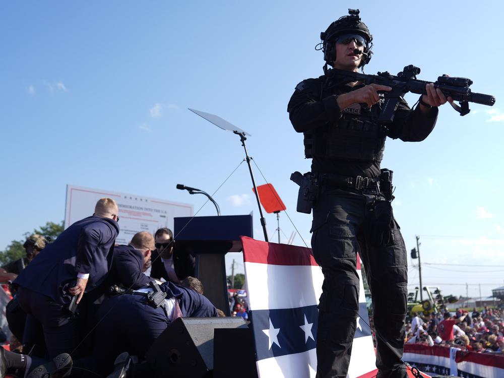 Republican presidential candidate Donald Trump is covered by U.S. Secret Service agents during the campaign rally in Butler, Pa., on July 13.
