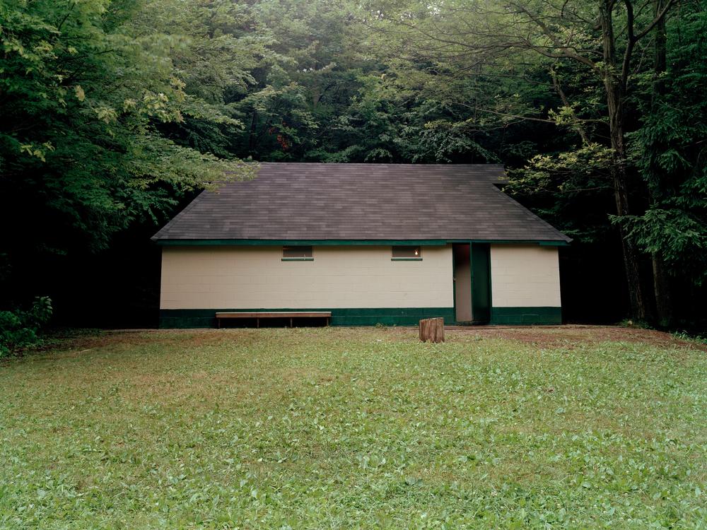 All of the buildings at Novyi Sokil were built to resemble homes in western Ukraine, including this latrine that houses the camp's showers and flushing toilets.