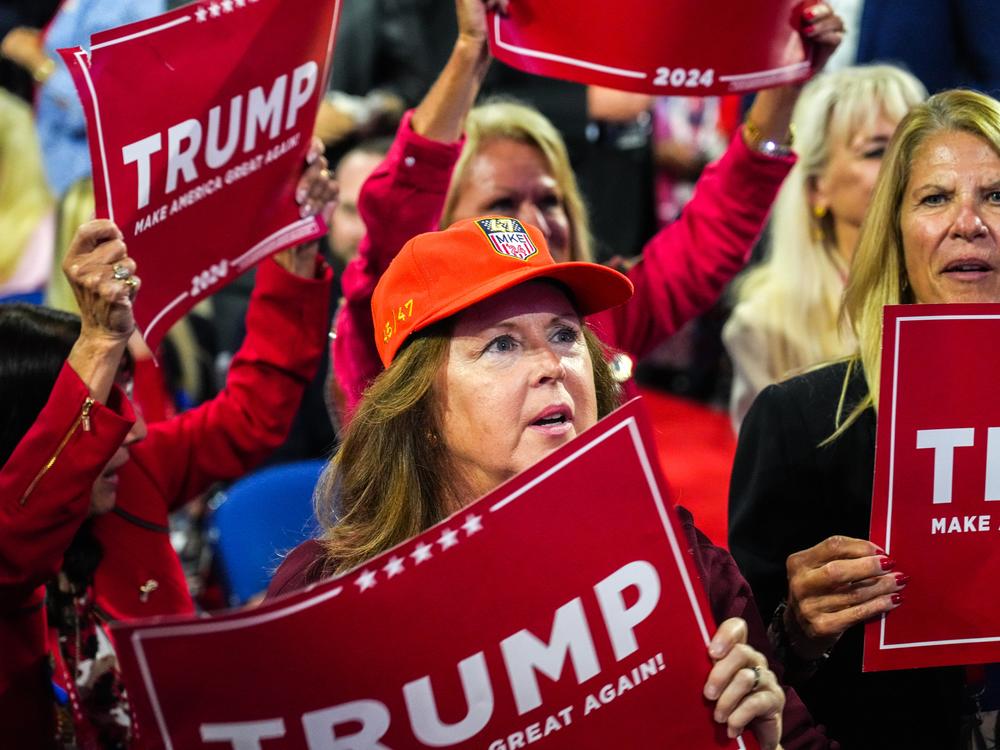An attendee of the 2024 Republican National Convention waits to hear the official announcement of Donald Trump's running mate.