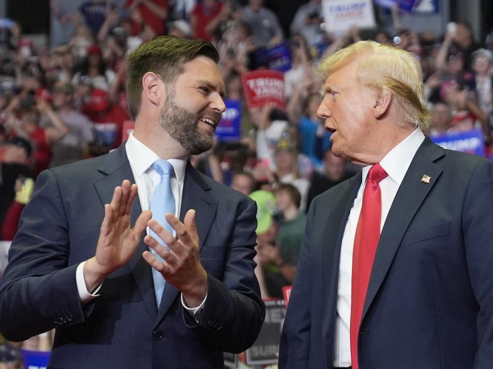 Former President Donald Trump and Republican vice presidential candidate Sen. J.D. Vance, R-Ohio, arrive a campaign rally on Saturday in Grand Rapids, Mich. 