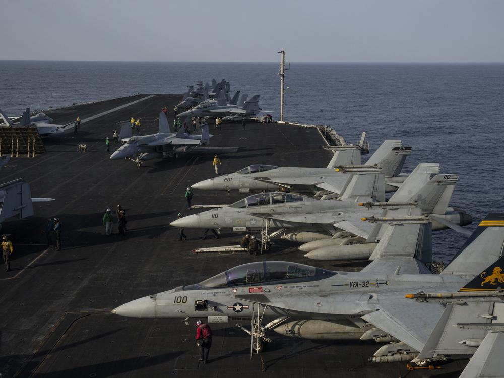 Fighter jets are parked on the deck of the U.S.S. aircraft carrier Dwight D. Eisenhower, also known as the 'Ike', on the south Red Sea, Monday, Feb. 12, 2024. (AP Photo/Bernat Armangue)