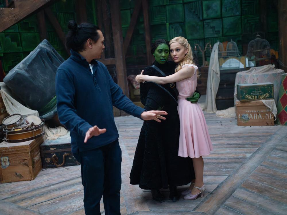  Jon M. Chu directs Cynthia Erivo and Ariana Grande on the set of <em>Wicked</em>.