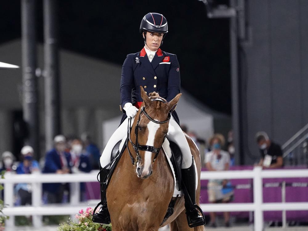 Britain's Charlotte Dujardin competes in the equestrian dressage individual final at the Tokyo Summer Olympics on July 28, 2021. Dujardin has withdrawn from the Paris Games after a video emerged that she says shows her behaving inappropriately while coaching other riders.