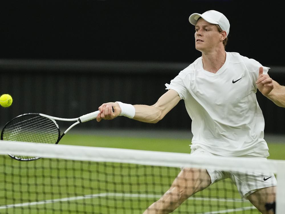 Jannik Sinner of Italy plays a forehand return during his third round match at the Wimbledon tennis championships in London, on July 5, 2024. He'll miss the 2024 Paris Olympics due to illness.