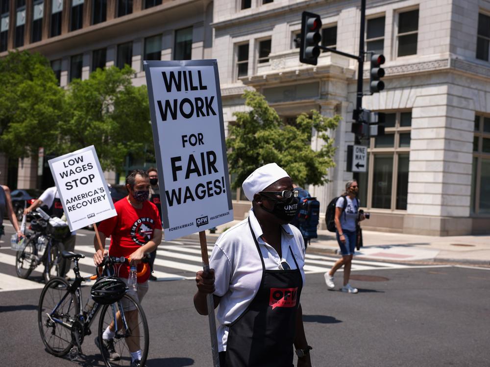 A protester participates in a “wage strike