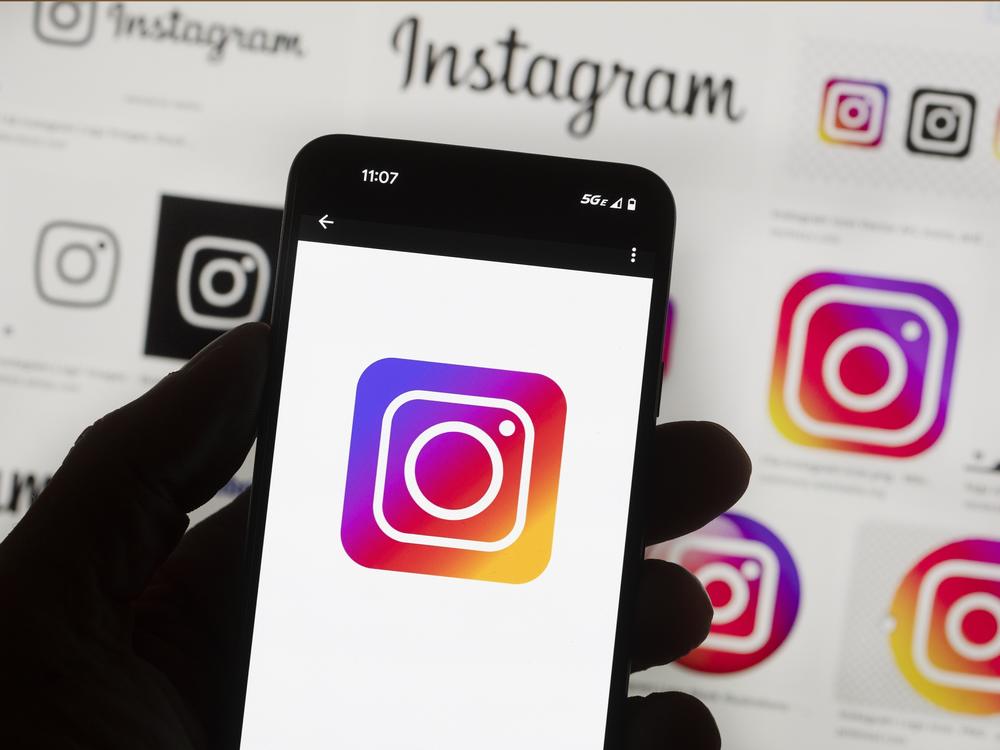 The Instagram logo is seen on a cellphone.