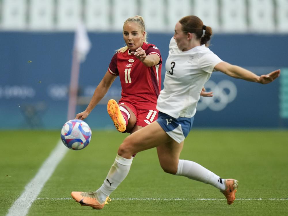 Canada's Adriana Leon, left, and New Zealand's Mackenzie Barry fight for the ball during the women's group match between Canada and New Zealand the 2024 Summer Olympics in Saint-Etienne, France on Thursday.