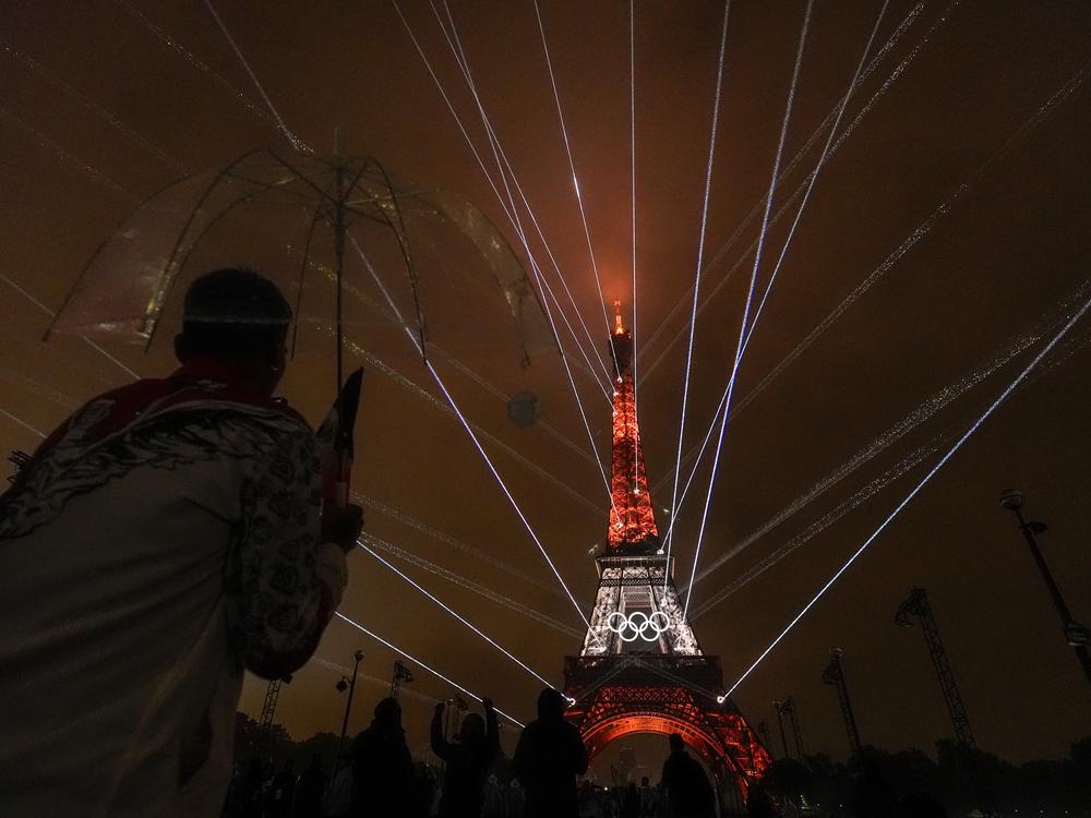 A light show is displayed on the Eiffel Tower during the opening ceremony of the 2024 Summer Olympics on Friday.