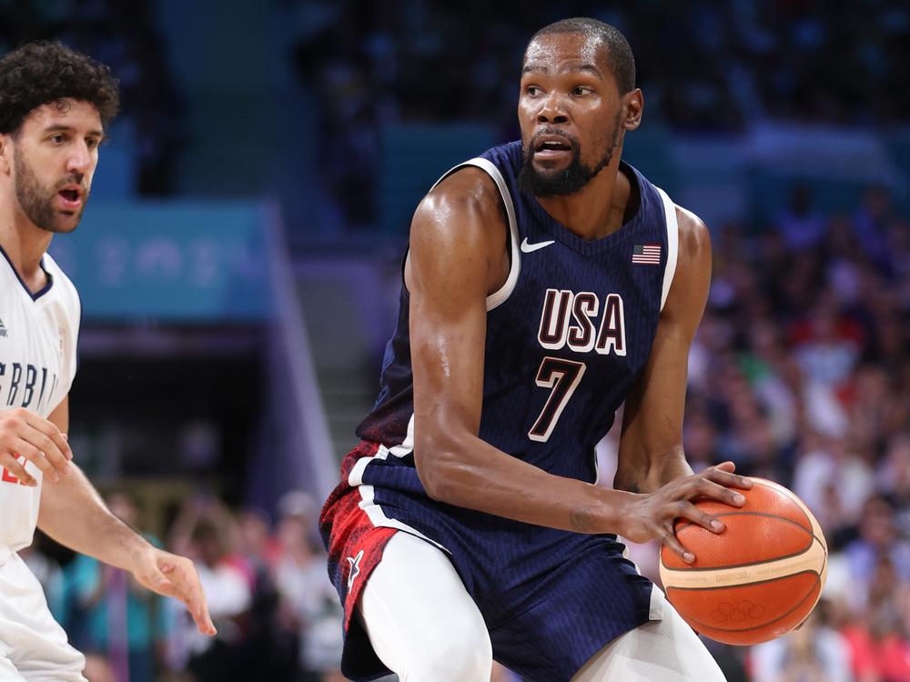 Kevin Durant of Team United States looks to pass against Serbia's Vasilije Micic (left) during the second half of Olympic group play at Stade Pierre Mauroy on Sunday in Lille, France.