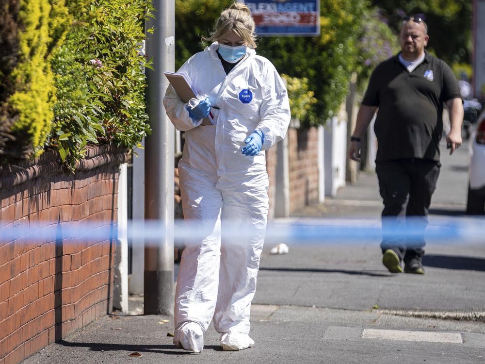 A police scenes of crime officer (SOCO) works at the scene in Southport, Merseyside, where a man has been detained and a knife has been seized after a number of people were injured in a reported stabbing on Monday.