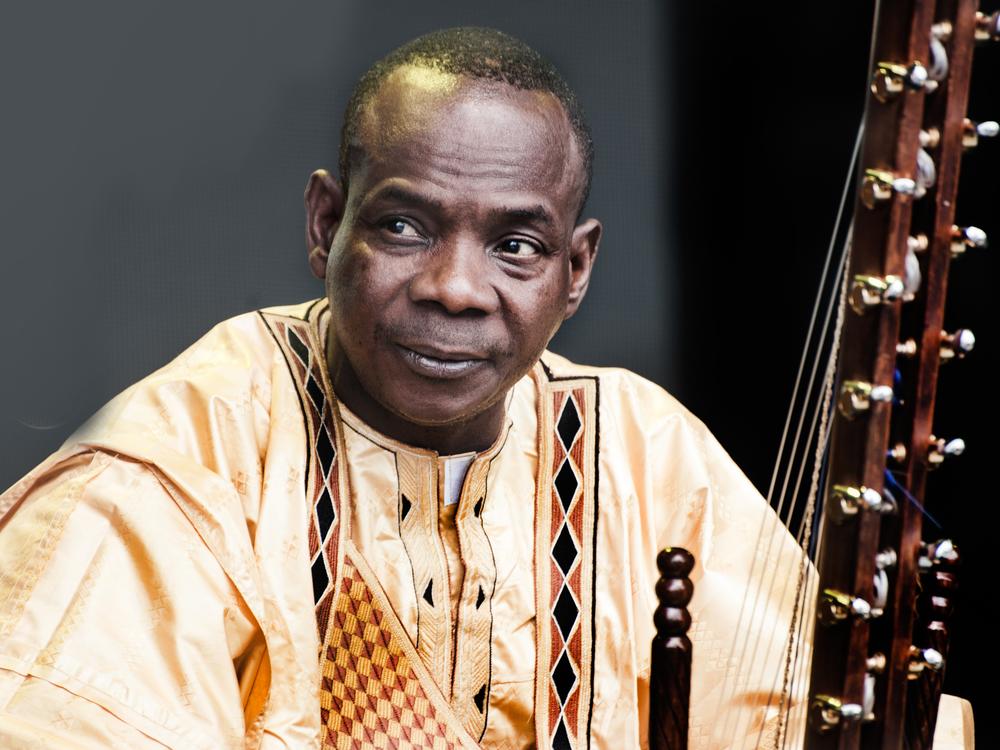Musician Toumani Diabaté of Mali and his 21-string kora, photographed at WOMAD -- the World of Music, Arts and Dance festival held yearly in the United Kingdom. Diabaté died on July 19 at age 58.<br>