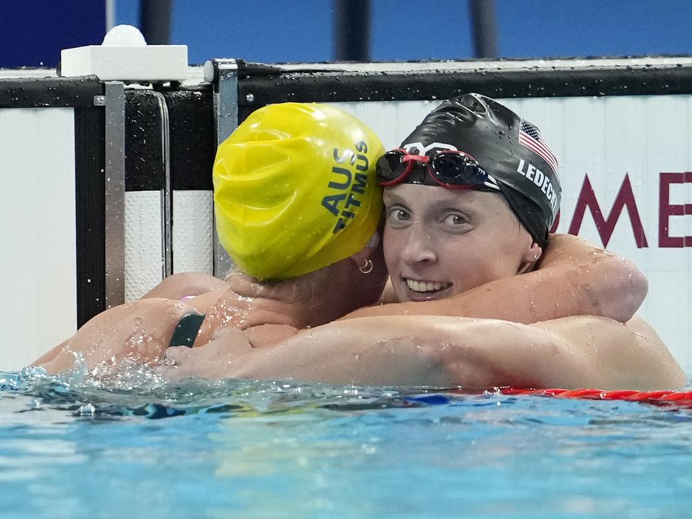 Ariarne Titmus, of Australia, left, celebrates after winning the women's 400-meter freestyle final with Katie Ledecky, of the United States, at the 2024 Summer Olympics last Saturday in Nanterre, France.
