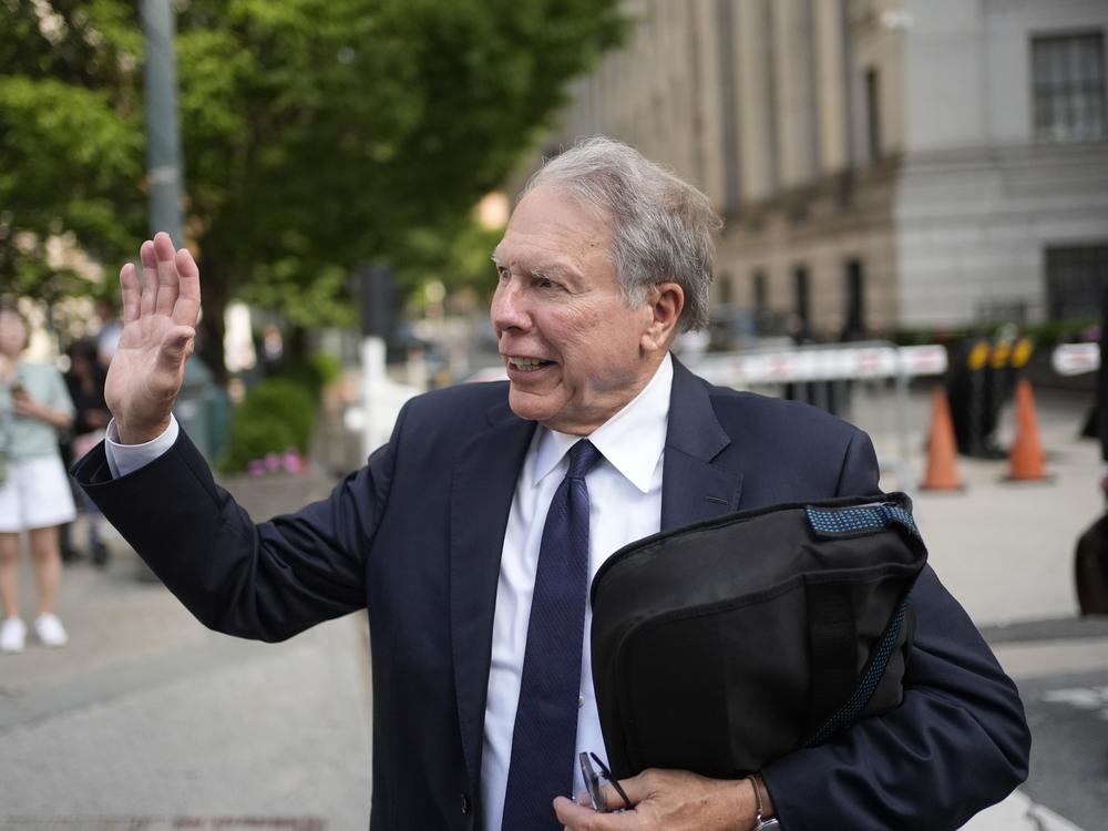Wayne LaPierre, former CEO of the National Rifle Association, waves to someone as he leaves a courthouse in New York, Monday, July 29, 2024. A New York judge declined to appoint an outside monitor to oversee the finances and internal policies of the National Rifle Association. But he said he would bar LaPierre, the group's former leader, from holding a paid position in the organization for a decade.