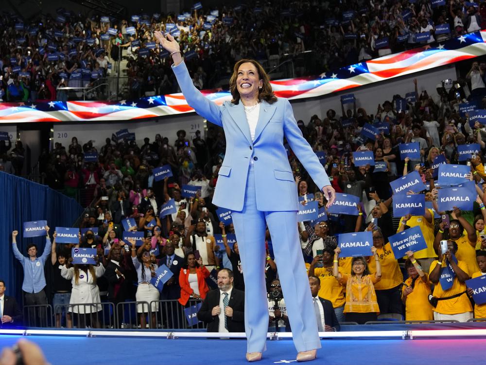 Vice President Harris waves during a packed campaign rally Tuesday in Atlanta.
