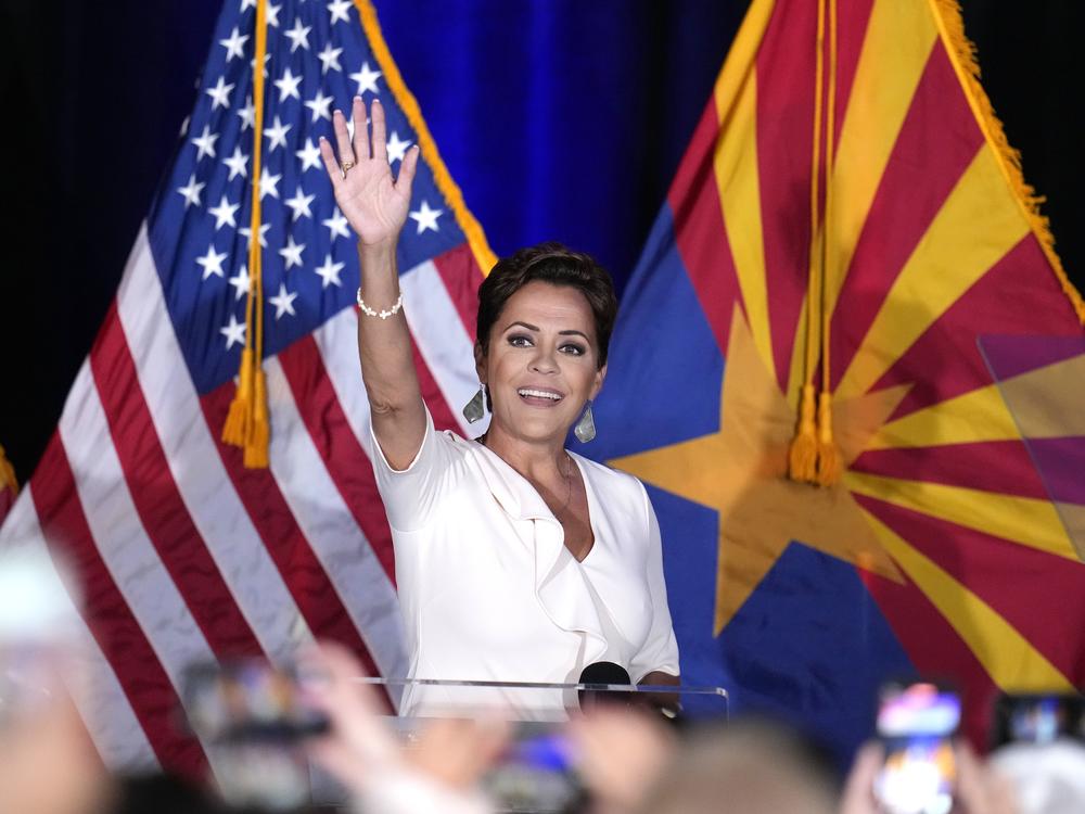 Republican Arizona Senate candidate Kari Lake waves to supporters as she arrives on stage after being declared her party's primary winner on Tuesday in Phoenix. 