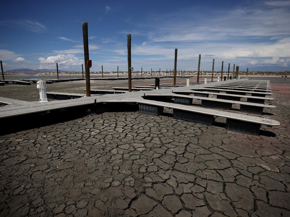 Boat docks sit on dry cracked earth at the Great Salt Lake's Antelope Island Marina in 2021 near Syracuse, Utah.