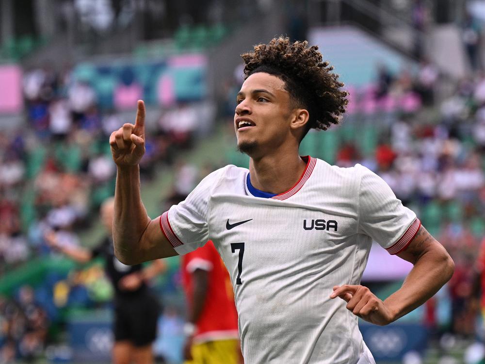 USA's Kevin Paredes celebrates scoring his team's second goal during a group match at the Paris Olympics between the United States and Guinea on Tuesday in Saint-Etienne, France. The U.S. defeated Guinea 3-0 to advance to the quarterfinals.
