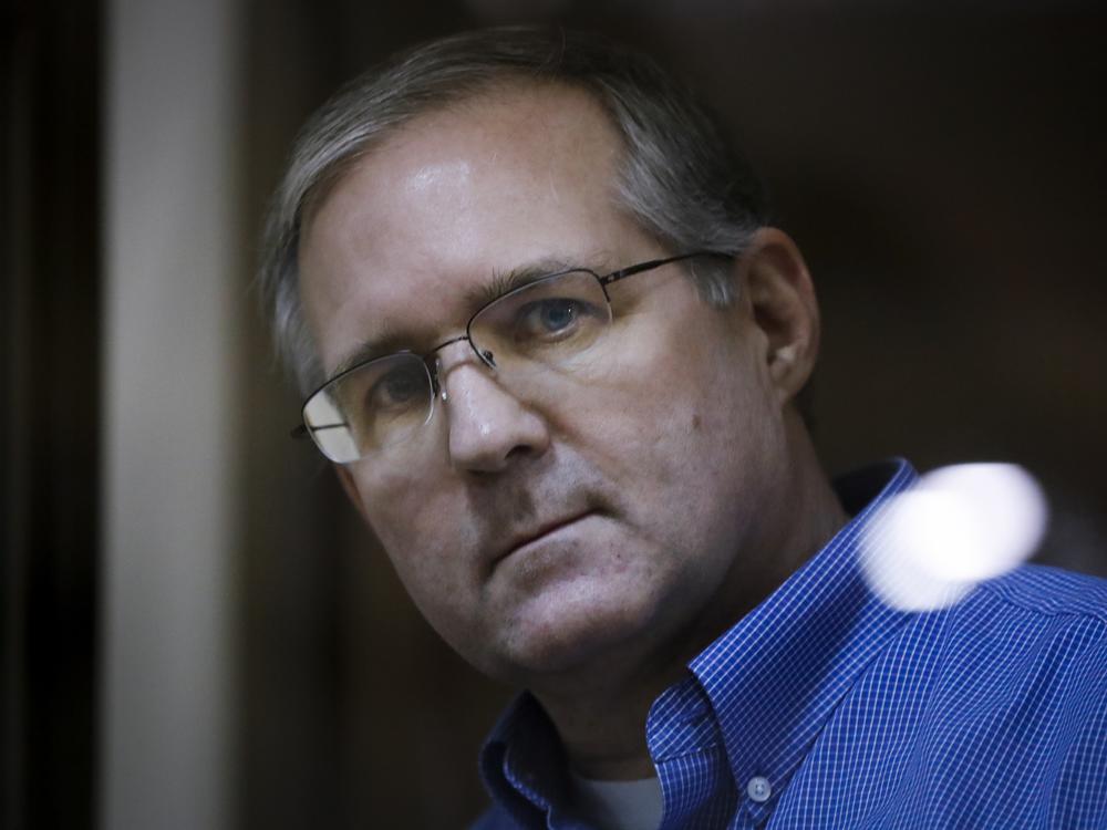Paul Whelan looks through a cage's glass in a courtroom in Moscow on Jan. 22, 2019. 