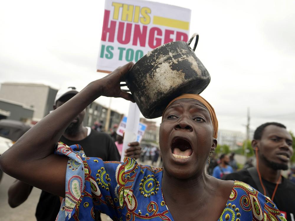 A woman protest against hardship on the street of Lagos, Nigeria, Thursday, Aug. 1, 2024. Thousands of mostly young people poured onto the streets across Nigeria on Thursday as they protested against the country's worst cost-of-living crisis in a generation. Security forces fired tear gas to disperse some of the protesters in the capital, Abuja.