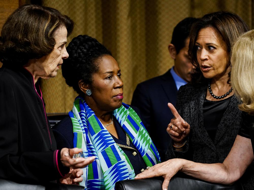 Then-Sen. Kamala Harris, D-Calif., speaks with Rep. Sheila Jackson Lee, D-Texas, and Sen. Dianne Feinstein, D-Calif., before a Senate Judiciary Committee hearing on Sept. 27, 2018.