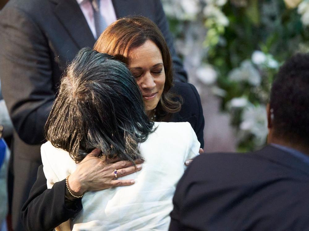 Vice President Harris hugs Robin Harris, the daughter of shooting victim Ruth Whitfield, during Whitfield's funeral service at Mt. Olive Baptist Church in Buffalo, N.Y., on May 28, 2022.