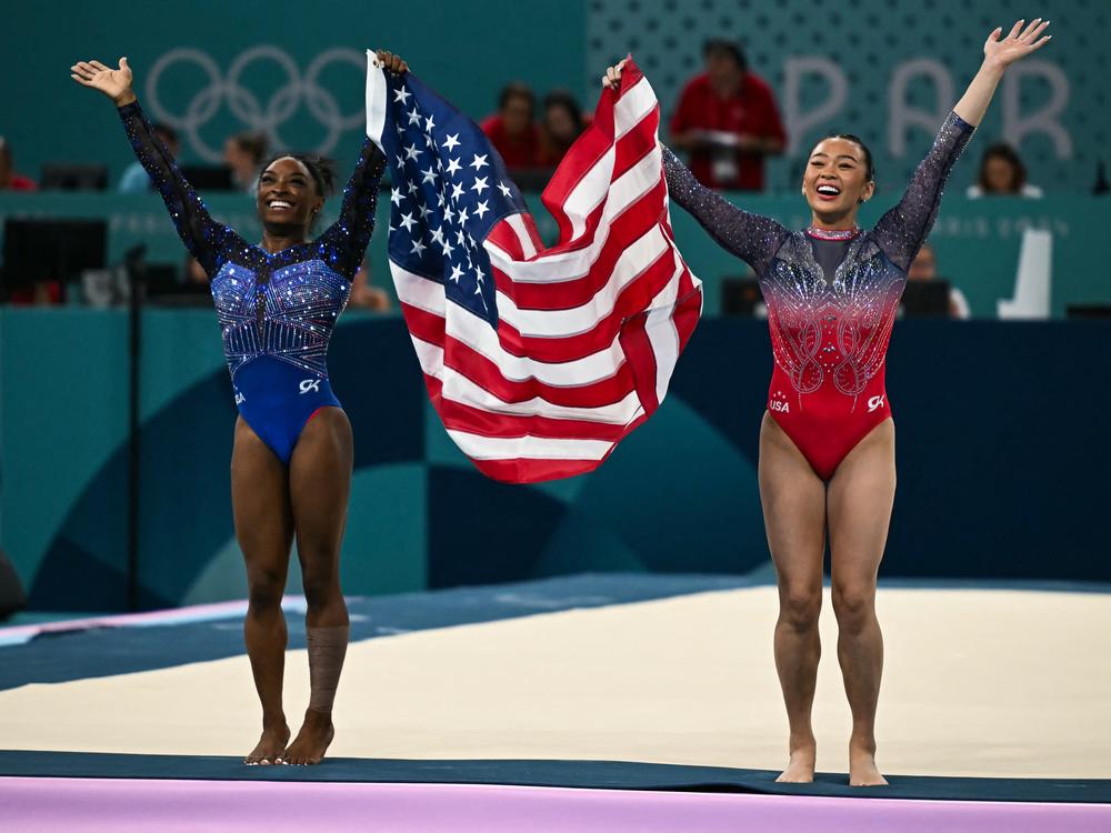 Olympic champion Simone Biles (L) and bronze medalist Sunisa Lee of the U.S. celebrate after the gymnastics women's all around final during the Paris 2024 Olympic Games on Thursday.