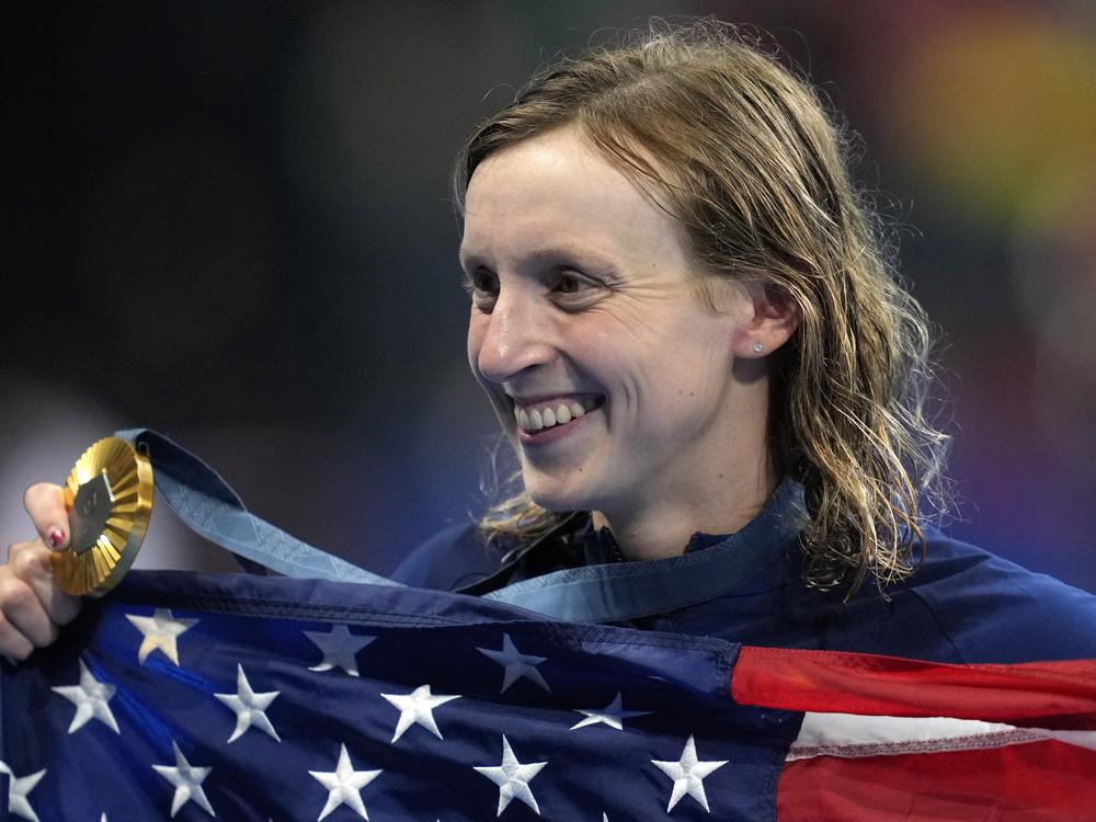 Team USA's Katie Ledecky poses after winning the women's 1500-meter freestyle final Wednesday at the 2024 Summer Olympics in Nanterre, France. On Thursday she won silver, boosting her total medal count to thirteen, more than any other female swimmer in Olympic history.