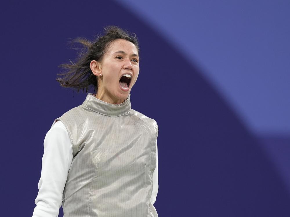 Lee Kiefer, of Team USA, reacts as she competes with Canada's Yunjia Zhang in the women's team foil semifinal match Thursday at the Grand Palais in Paris.