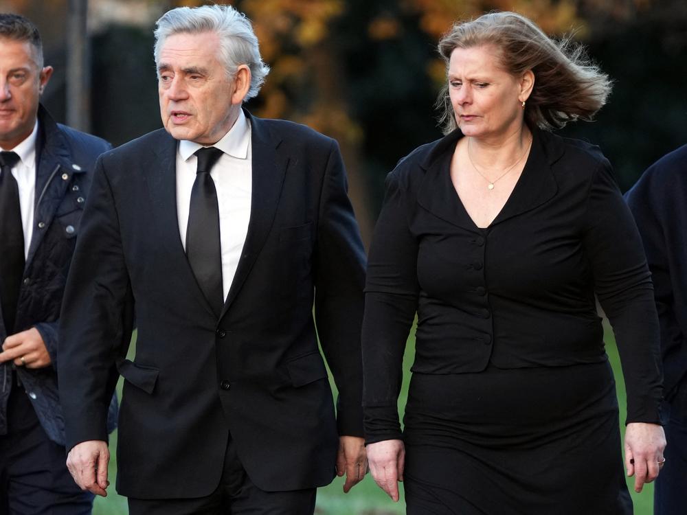 Former British Prime Minister Gordon Brown, shown here with his wife Sarah in 2023, says Rupert Murdoch's U.K. tabloids hacked into his voicemails and documents to learn private information about him and his family. A 2011 police memo shows Washington Post CEO Will Lewis, then working for Murdoch, cited a security threat involving Brown as a reason to delete company emails. 