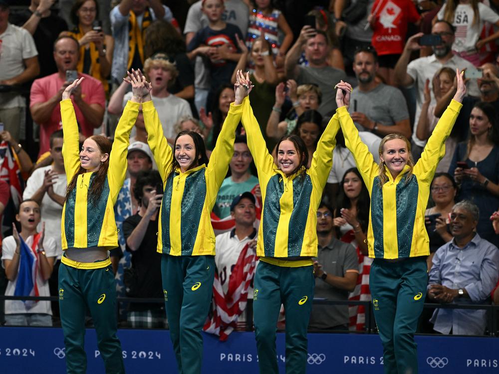 Team Australia's Mollie O'Callaghan, Lani Pallister, Brianna Throssell and Ariarne Titmus celebrate after the women's 4x200m freestyle relay swimming event. Swimmers have said the Paris Olympics pool is the same for everyone — and that the arena has been an exciting place to swim.