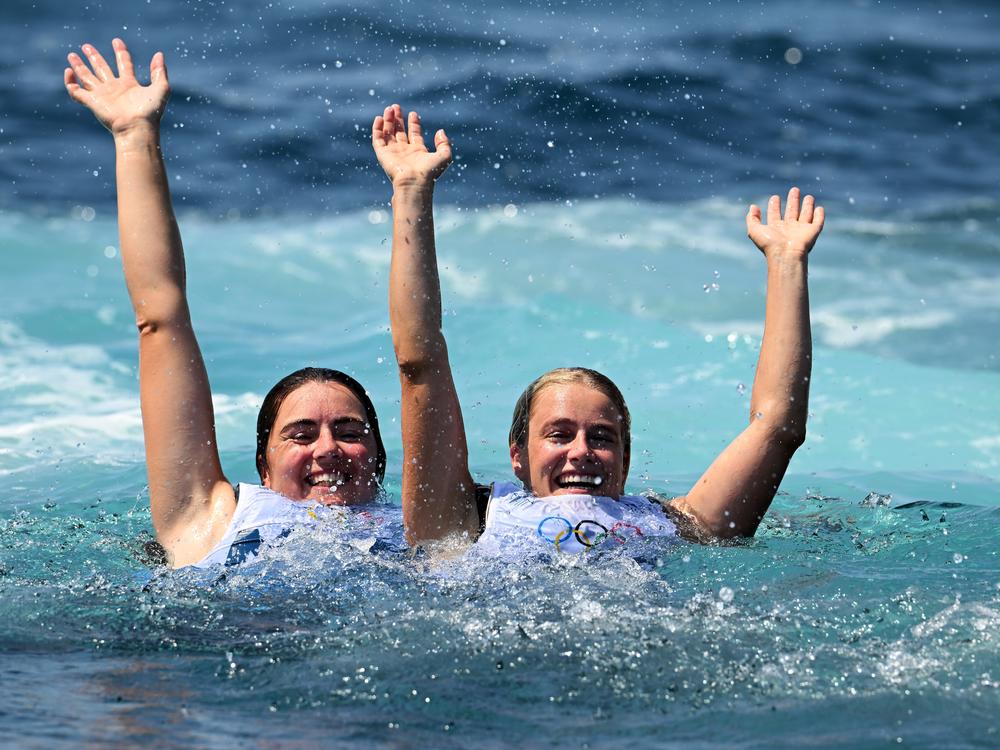 Annette Duetz (left) and Odile van Aanholt celebrate winning gold in women's skiff at Marseille Marina in the Paris Olympic Games.