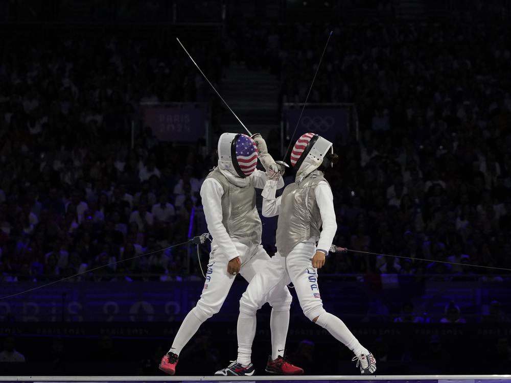 Lee Kiefer competes against Lauren Scruggs, both from the United States, in the women's individual foil final match on Sunday.