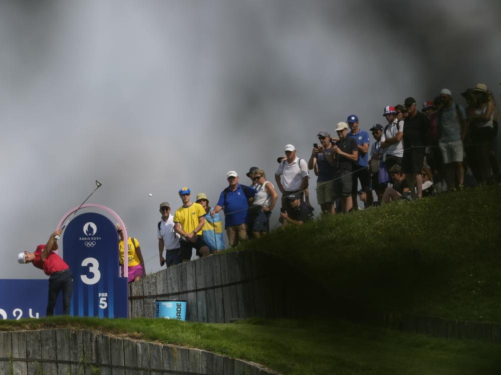 Joaquin Niemann, of Chile, tees off in front of a crowd on the third hole during the second round of the men's golf event on Friday.