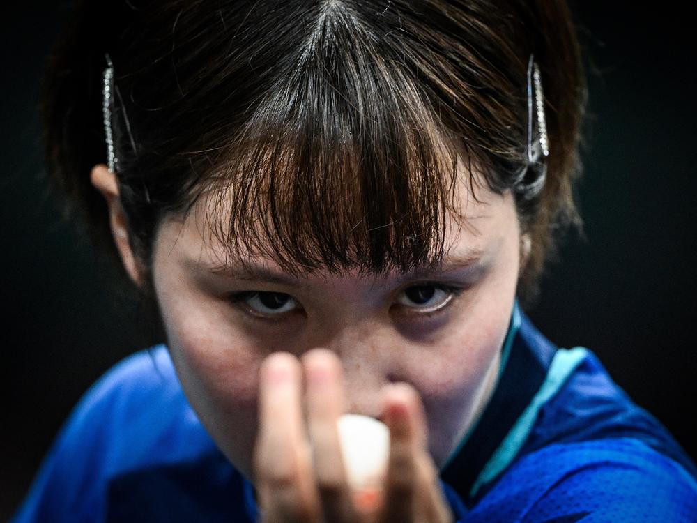 Japan's Miu Hirano eyes the ball as she prepares to serve to India's Manika Batra during their women's table tennis singles round of 16 on Wednesday.